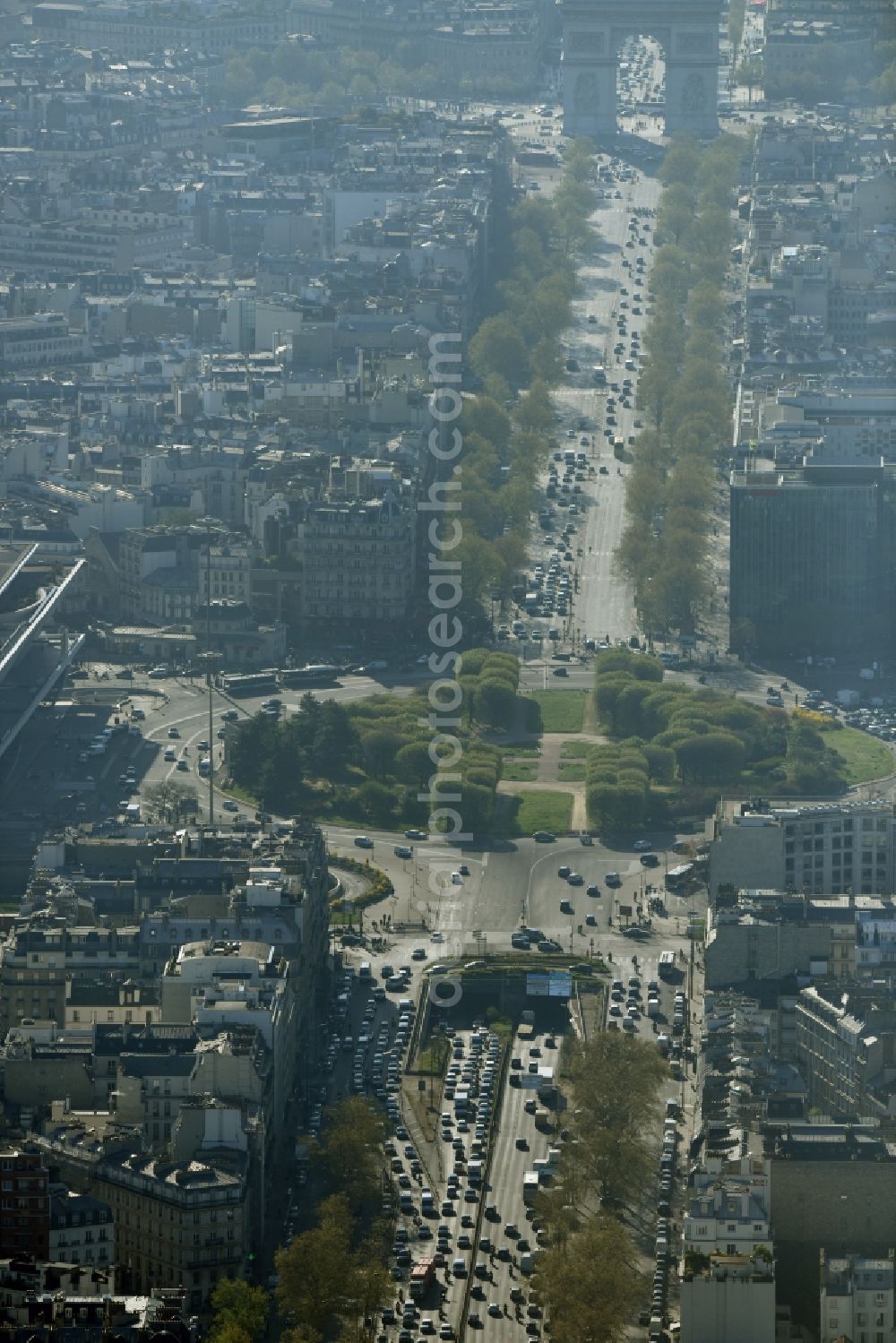 Aerial image Paris - Place de la Porte Maillot square at the end of Avenue Charles De Gaulle in Paris in Ile-de-France, France. The square is located on the famous street course Axe historique