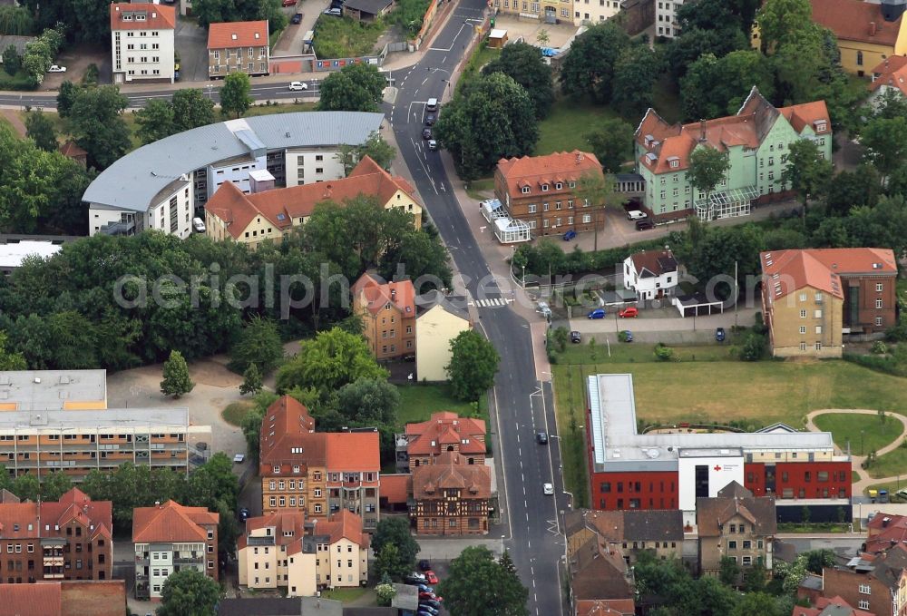 Eisenach from above - In the Hospitalstrass of Eisenach in Thuringia is home to the nursing home Fischerstadt and the retirement home Justusstift. The retirement home is located in the building with the semi-circular plan. The nursing home is the building in the foreground with the wine-red façade and the white staircase. The nursing home is nestled in a green oasis of entrance, the garden island and roof gardens