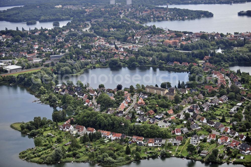 Aerial image Plön - Blick über die Kreisstadt Plön. Sie hat etwa 13.000 Einwohner und liegt direkt am größten Binnensee Schleswig-Holsteins, dem Großen Plöner See. Wahrzeichen der Stadt ist das Schloss, das im 17. Jahrhundert erbaut wurde. View over the town Ploen. It has about 13,000 inhabitants and is located on the largest lake in Schleswig-Holstein, the Great Poen Lake. Landmark of the city is the castle which was built in the 17th Century.