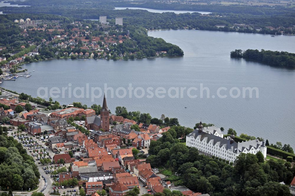 Plön from above - Blick über die Kreisstadt Plön. Sie hat etwa 13.000 Einwohner und liegt direkt am größten Binnensee Schleswig-Holsteins, dem Großen Plöner See. Wahrzeichen der Stadt ist das Schloss, das im 17. Jahrhundert erbaut wurde. View over the town Ploen. It has about 13,000 inhabitants and is located on the largest lake in Schleswig-Holstein, the Great Poen Lake. Landmark of the city is the castle which was built in the 17th Century.