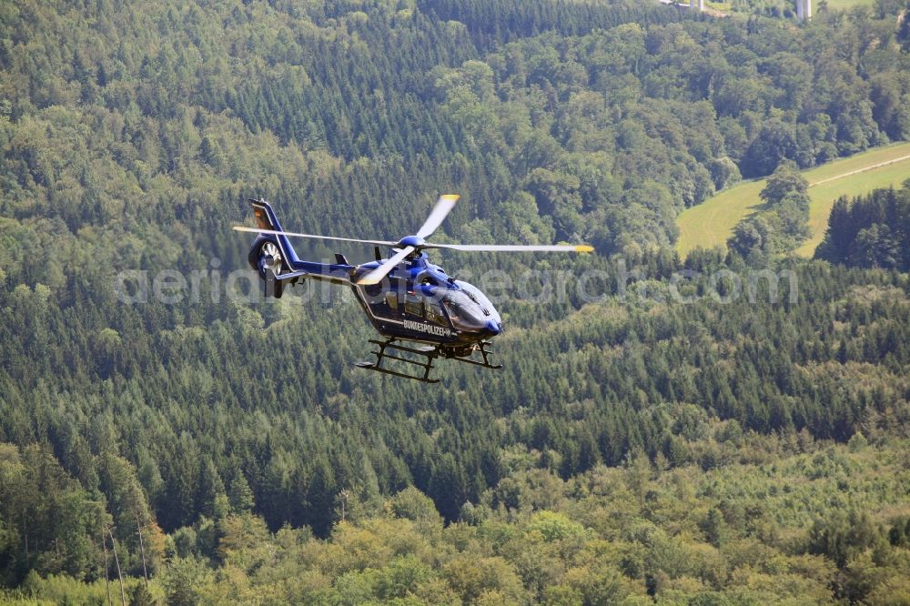 Aerial image Rheinfelden (Baden) - Helicopter in flight EC 135 of federal police mission D-HVBD over the air space in Rheinfelden (Baden) in the state Baden-Wuerttemberg