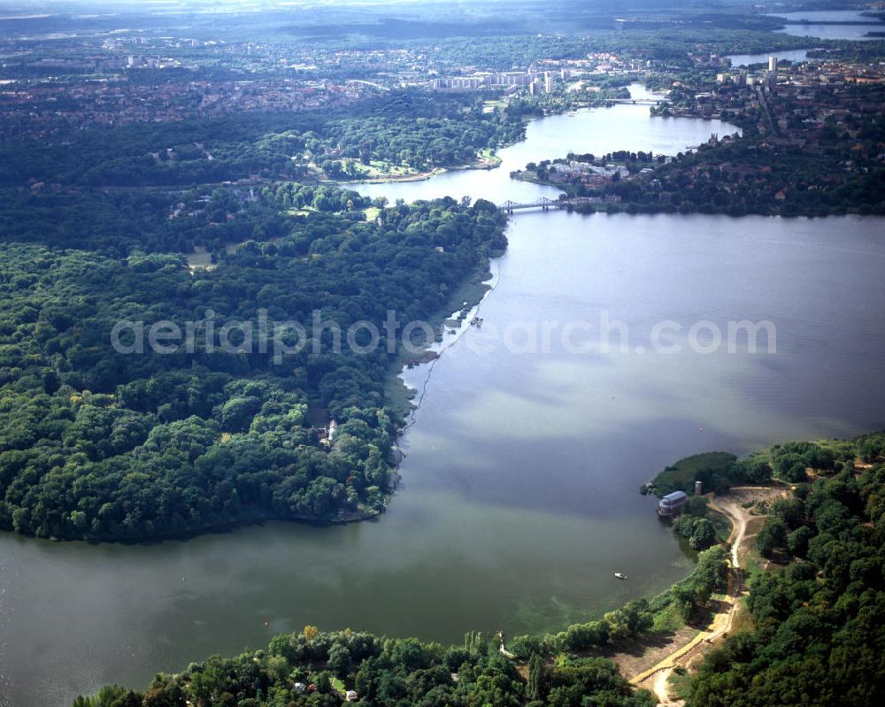 Aerial image Potsdam Sacrow - Blick von Sacrow mit der Heilandskirche am Jungfernsee in Richtung Glienicker Brücke und Potsdam-Zentrum. Die Brücke verbindet über die Havel hinweg die Städte Berlin, Ortsteil Wannsee des Bezirks Steglitz-Zehlendorf, und Potsdam, Stadtteil Berliner Vorstadt mit dem Glienicker Horn. View from Sacrow with the church Heilandskirche at the lake Jungfernsee in to the direction Glienicke Bridge and the centre of Potsdam. The Glienicke bridge is a bridge on the edge of Berlin that spans the Havel River to connect the cities of Potsdam and Berlin.