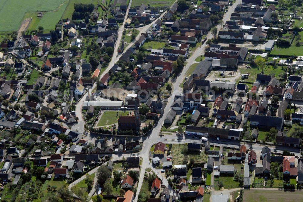 Aerial image Pressel - Blick auf Pressel in Sachsen mit Blick auf die Kirche der Gemeinde. Pressel liegt zwischen Bad Düben, Bad Schmiedeberg und Torgau inmitten des Naturparks Dübener Heide . Die idyllische Lage im Naturgebiet läd zu vielerlei Unternehmungen ein und ist ein Anziehungspunkt für Touristen. Eine Sehenswürdigkeit ist die frisch restaurierte Kirche der Gemeinde. Diese wurde bereits 1857 eingeweiht. Touristeninformation: Touristinformation Pressel, Hinterhäuser 23, 04849 Pressel, Tel. +49(0)3 4243 289637, Fax +49(0)3 4243 27232, Email: Touristinfo@verein-pressel.de