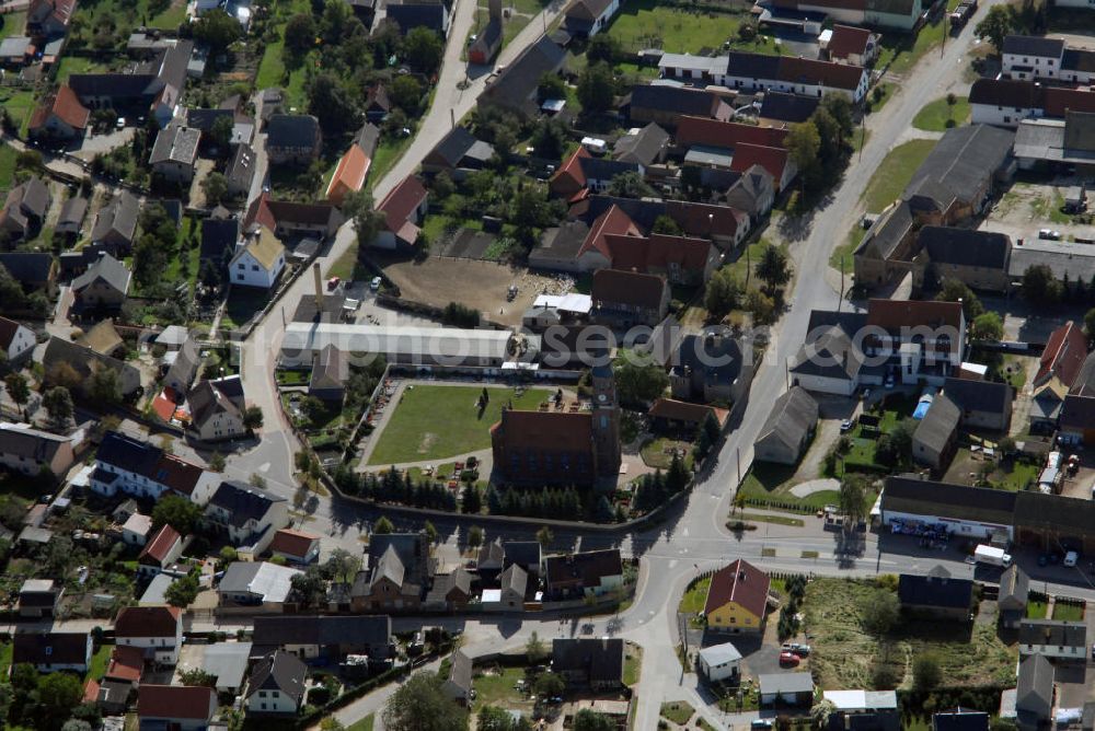 Aerial photograph Pressel - Blick auf Pressel in Sachsen mit Blick auf die Kirche der Gemeinde. Pressel liegt zwischen Bad Düben, Bad Schmiedeberg und Torgau inmitten des Naturparks Dübener Heide . Die idyllische Lage im Naturgebiet läd zu vielerlei Unternehmungen ein und ist ein Anziehungspunkt für Touristen. Eine Sehenswürdigkeit ist die frisch restaurierte Kirche der Gemeinde. Diese wurde bereits 1857 eingeweiht. Touristeninformation: Touristinformation Pressel, Hinterhäuser 23, 04849 Pressel, Tel. +49(0)3 4243 289637, Fax +49(0)3 4243 27232, Email: Touristinfo@verein-pressel.de