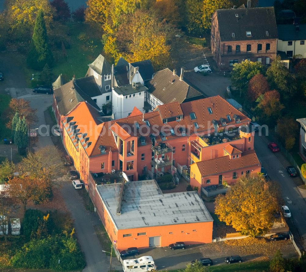 Witten from above - Private distillery Sunshine in Herbede in the state of North Rhine-Westphalia. The building complex includes an orange front and consists of historic and modern parts