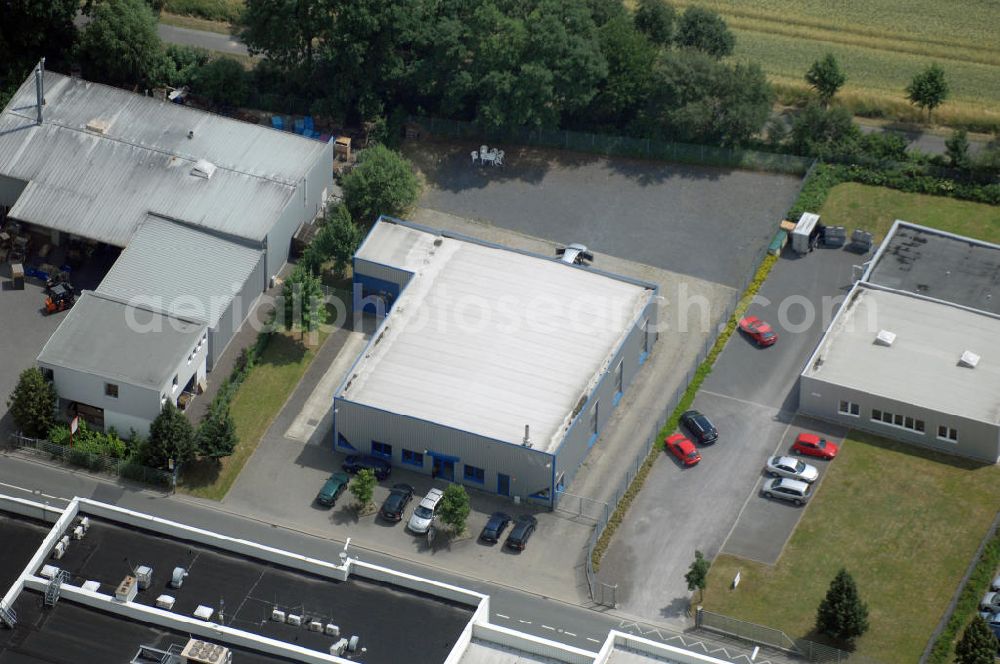 Bönen from the bird's eye view: Blick auf eine Produktionshalle mit integriertem Büro und LKW Waage. Adresse: Gewerbegebiet Bönen, Schulstrasse, 59199 Bönen; Vermietung / Verwaltung: Unternehmensgruppe Markus Gerold, An der Vaerstbrücke 1, 59425 Unna, Tel. +49(0)2303 25036-26, Fax +49(0)2303 25036-27, E-Mail: info@markus-gerold.de