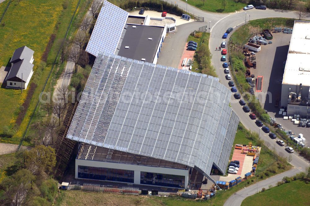 Aerial image Oelsnitz - Blick auf eine neue Produktionshalle der Firma Meiser Gitterroste im Industriegebiet am Johannisberg. Sie wurde vom Architekten Jürgen T. Christ entworfen. Kontakt: Meiser Gitterroste KG, Am Lehmteich 3, 08606 Oelsnitz, Tel. +49(0)37421 50 0, Fax +49(0)37421 50 2120,