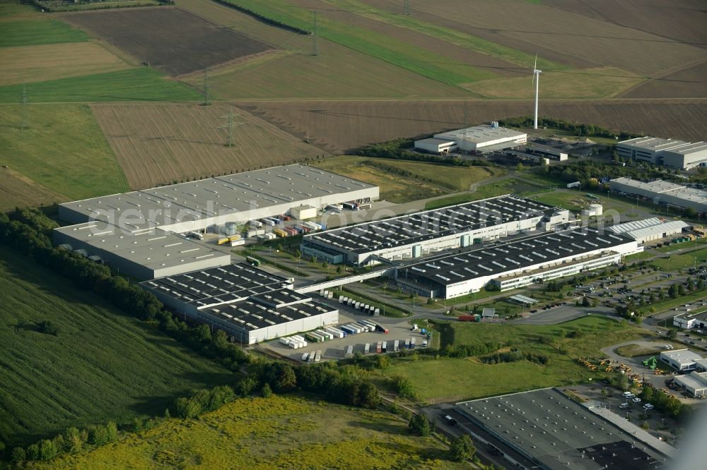 Aerial image Nauen - Production facilities and company buildings of BSH House machines Nauen GmbH in Nauen in the state of Brandenburg. The works include a cargo and logistics centre. The site is located on the edge of a field