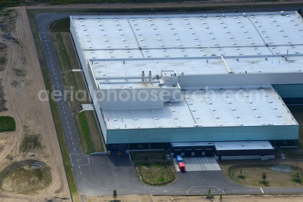 Schwerin from the bird's eye view: Production site of Nestlé Dolce Gusto in the Industrial Park Schwerin in Schwerin in the state of Mecklenburg - Western Pomerania. The newly developed industrial and commercial area is currently under construction in a forest area in the South of Schwerin. Some buildings - such as the new works of the coffee capsule company - are already in use