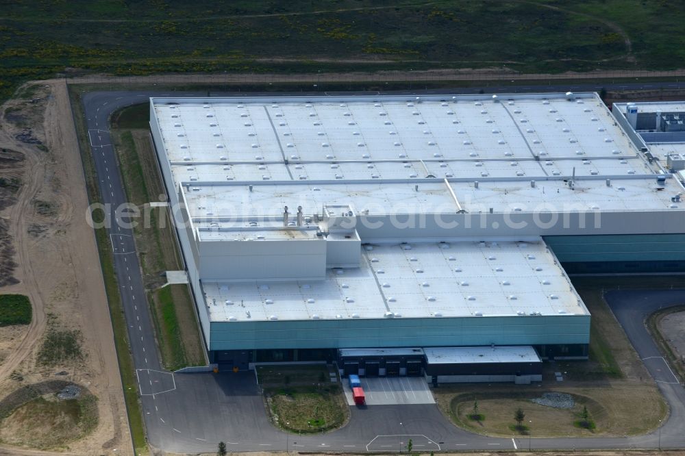 Aerial image Schwerin - Production site of Nestlé Dolce Gusto in the Industrial Park Schwerin in Schwerin in the state of Mecklenburg - Western Pomerania. The newly developed industrial and commercial area is currently under construction in a forest area in the South of Schwerin. Some buildings - such as the new works of the coffee capsule company - are already in use