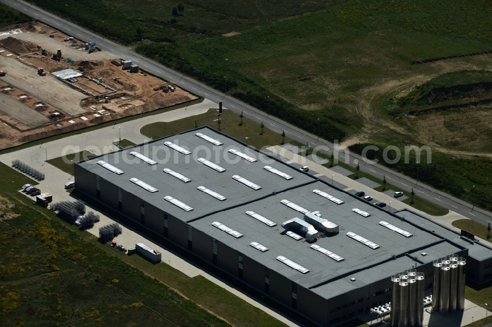 Schwerin from above - Production site of Procap in the Industrial Park Schwerin in Schwerin in the state of Mecklenburg - Western Pomerania. The newly developed industrial and commercial area is currently under construction in a forest area in the South of Schwerin. Some buildings - such as the new works of the plastics manufacturer - are already in use