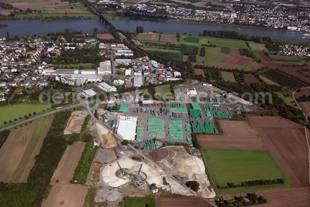 Aerial image Urmitz - Die Produktionsstätte der Firma Rünz & Hoffend KG an der Brückenstraße. Das Unternehmen produziert Baustoffe aus Bimsstein. The production facility of the company Rünz & Hoffend KG at the Bruckenstrasse. The company produces building materials made of pumice.