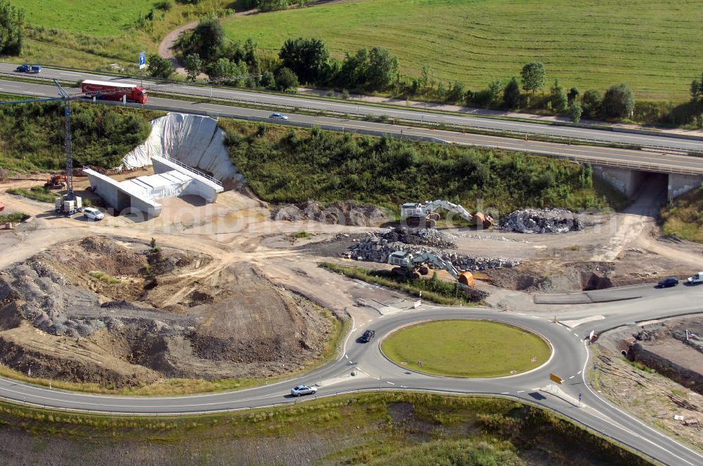 Eisenach from the bird's eye view: Blick auf die Baustelle der Ausfahrt / Anschlussstelle Eisenach-West der A4. Hier eine Überführung zur B7 und eine Unterführung im Südteil mit Kreisverkehr. Der Neubau ist Teil des Projekt Nordverlegung / Umfahrung Hörselberge der Autobahn E40 / A4 in Thüringen bei Eisenach. Durchgeführt werden die im Zuge dieses Projektes notwendigen Arbeiten unter an derem von den Mitarbeitern der Niederlassung Weimar der EUROVIA Verkehrsbau Union sowie der Niederlassungen Abbruch und Erdbau, Betonstraßenbau, Ingenieurbau und TECO Schallschutz der EUROVIA Beton sowie der DEGES.