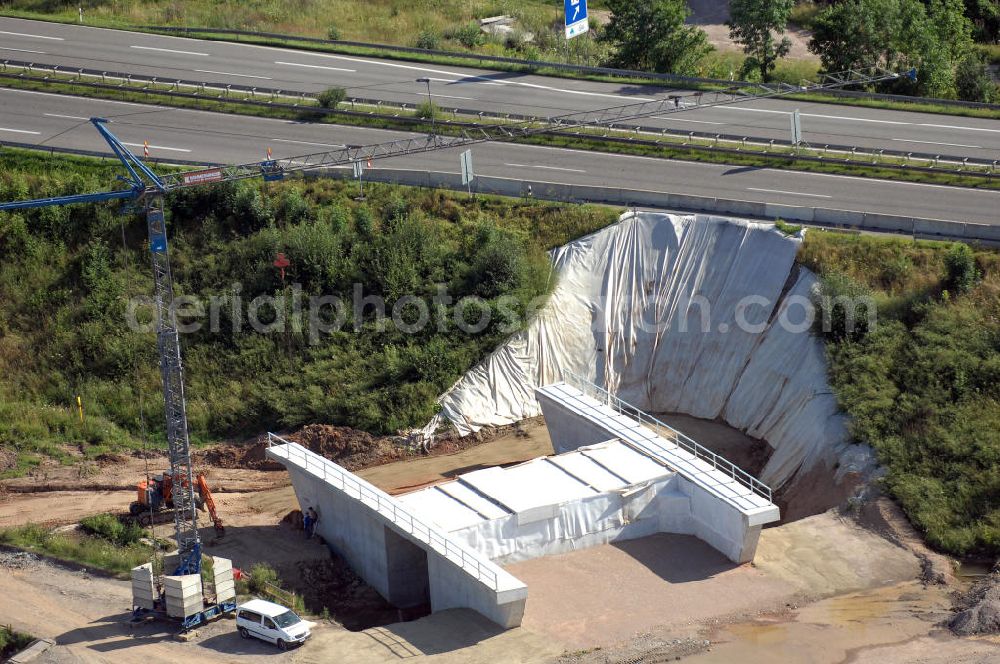 Aerial image Eisenach - Blick auf die Baustelle der Ausfahrt / Anschlussstelle Eisenach-West der A4. Hier eine Überführung zur B7 im Südteil. Der Neubau ist Teil des Projekt Nordverlegung / Umfahrung Hörselberge der Autobahn E40 / A4 in Thüringen bei Eisenach. Durchgeführt werden die im Zuge dieses Projektes notwendigen Arbeiten unter an derem von den Mitarbeitern der Niederlassung Weimar der EUROVIA Verkehrsbau Union sowie der Niederlassungen Abbruch und Erdbau, Betonstraßenbau, Ingenieurbau und TECO Schallschutz der EUROVIA Beton sowie der DEGES.