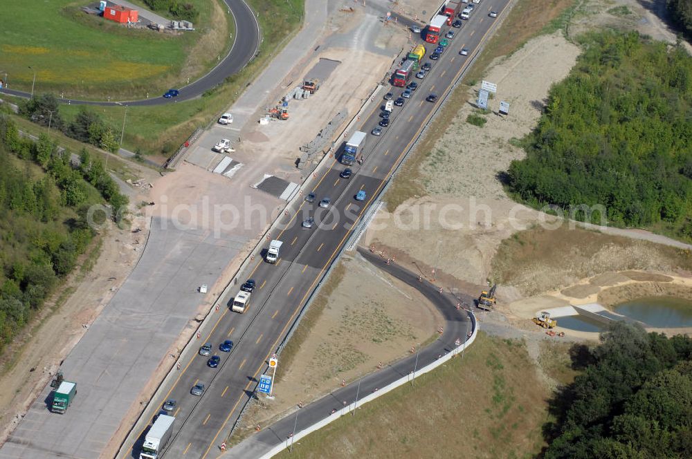 Aerial image Eisenach - Blick auf die Baustelle einer Unterführung der A4 mit Regenrückhaltebecken westlich der Raststätte Eisenach. Der Neubau ist Teil des Projekt Nordverlegung / Umfahrung Hörselberge der Autobahn E40 / A4 in Thüringen bei Eisenach. Durchgeführt werden die im Zuge dieses Projektes notwendigen Arbeiten unter an derem von den Mitarbeitern der Niederlassung Weimar der EUROVIA Verkehrsbau Union sowie der Niederlassungen Abbruch und Erdbau, Betonstraßenbau, Ingenieurbau und TECO Schallschutz der EUROVIA Beton sowie der DEGES.