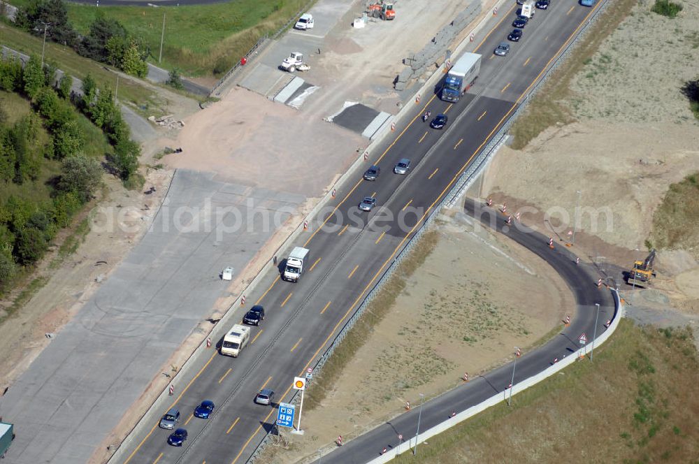 Aerial photograph Eisenach - Blick auf die Baustelle einer Unterführung der A4 westlich der Raststätte Eisenach. Der Neubau ist Teil des Projekt Nordverlegung / Umfahrung Hörselberge der Autobahn E40 / A4 in Thüringen bei Eisenach. Durchgeführt werden die im Zuge dieses Projektes notwendigen Arbeiten unter an derem von den Mitarbeitern der Niederlassung Weimar der EUROVIA Verkehrsbau Union sowie der Niederlassungen Abbruch und Erdbau, Betonstraßenbau, Ingenieurbau und TECO Schallschutz der EUROVIA Beton sowie der DEGES.