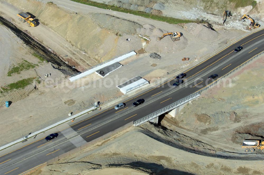 Eisenach from the bird's eye view: Blick auf die Baustelle einer Unterführung der A4 östlich der Raststätte Eisenach. Der Neubau ist Teil des Projekt Nordverlegung / Umfahrung Hörselberge der Autobahn E40 / A4 in Thüringen bei Eisenach. Durchgeführt werden die im Zuge dieses Projektes notwendigen Arbeiten unter an derem von den Mitarbeitern der Niederlassung Weimar der EUROVIA Verkehrsbau Union sowie der Niederlassungen Abbruch und Erdbau, Betonstraßenbau, Ingenieurbau und TECO Schallschutz der EUROVIA Beton sowie der DEGES.