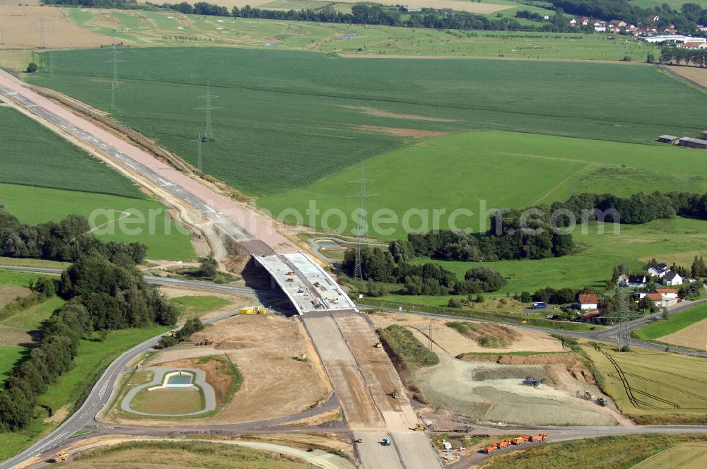 Aerial photograph Großenlupnitz - Blick auf die Baustelle der neuen Böbertalbrücke mit einer Länge von 370 m an der Ausfahrt / Anschlussstelle Eisenach-Ost mit einem neuen Regenrückhaltebecken. Die Brücke ist Teil des Projekt Nordverlegung / Umfahrung Hörselberge der Autobahn E40 / A4 in Thüringen bei Eisenach. Durchgeführt werden die im Zuge dieses Projektes notwendigen Arbeiten unter an derem von den Mitarbeitern der Niederlassung Weimar der EUROVIA Verkehrsbau Union sowie der Niederlassungen Abbruch und Erdbau, Betonstraßenbau, Ingenieurbau und TECO Schallschutz der EUROVIA Beton sowie der DEGES.