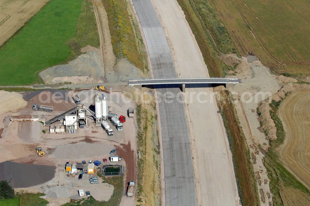 Aerial photograph Neukirchen - Blick auf die Baustelle der Strassenbrücke südlich von Neukirchen welche über die A4 führt. Der Neubau ist Teil des Projekt Nordverlegung / Umfahrung Hörselberge der Autobahn E40 / A4 in Thüringen bei Eisenach. Durchgeführt werden die im Zuge dieses Projektes notwendigen Arbeiten unter an derem von den Mitarbeitern der Niederlassung Weimar der EUROVIA Verkehrsbau Union sowie der Niederlassungen Abbruch und Erdbau, Betonstraßenbau, Ingenieurbau und TECO Schallschutz der EUROVIA Beton sowie der DEGES.