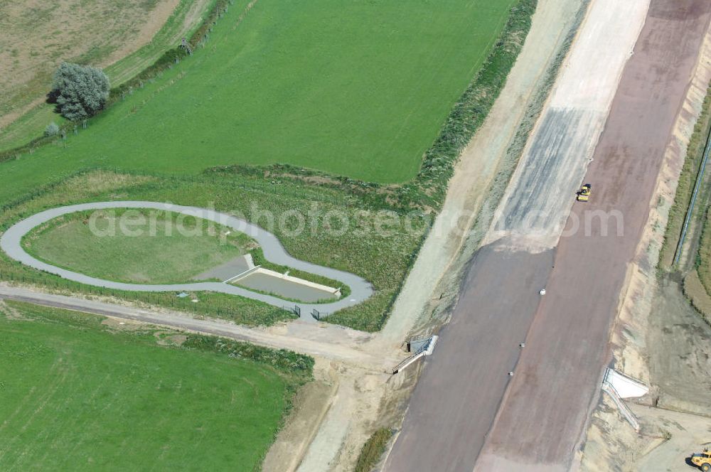 Wenigenlupnitz from the bird's eye view: Blick auf die Baustelle einer Unterführung mit Regenrückhaltebecken der A4 bei Wenigenlupnitz westlich der PWC-Anlage / Rastplatz. Der Neubau ist Teil des Projekt Nordverlegung / Umfahrung Hörselberge der Autobahn E40 / A4 in Thüringen bei Eisenach. Durchgeführt werden die im Zuge dieses Projektes notwendigen Arbeiten unter an derem von den Mitarbeitern der Niederlassung Weimar der EUROVIA Verkehrsbau Union sowie der Niederlassungen Abbruch und Erdbau, Betonstraßenbau, Ingenieurbau und TECO Schallschutz der EUROVIA Beton sowie der DEGES.