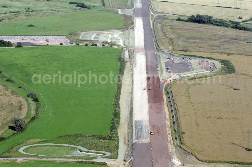 Wenigenlupnitz from the bird's eye view: Blick auf die Baustelle einer Unterführung mit Regenrückhaltebecken westlich der südlichen (v) und nördlichen (h) PWC-Anlage / Parkplatz mit WC / Rastplatz der A4 bei Wenigenlupnitz. Der Neubau ist Teil des Projekt Nordverlegung / Umfahrung Hörselberge der Autobahn E40 / A4 in Thüringen bei Eisenach. Durchgeführt werden die im Zuge dieses Projektes notwendigen Arbeiten unter an derem von den Mitarbeitern der Niederlassung Weimar der EUROVIA Verkehrsbau Union sowie der Niederlassungen Abbruch und Erdbau, Betonstraßenbau, Ingenieurbau und TECO Schallschutz der EUROVIA Beton sowie der DEGES.