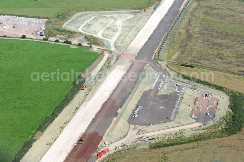 Aerial photograph Wenigenlupnitz - Blick auf die Baustelle der südlichen (v) und nördlichen (h) PWC-Anlage / Parkplatz mit WC / Rastplatz der A4 bei Wenigenlupnitz. Der Neubau ist Teil des Projekt Nordverlegung / Umfahrung Hörselberge der Autobahn E40 / A4 in Thüringen bei Eisenach. Durchgeführt werden die im Zuge dieses Projektes notwendigen Arbeiten unter an derem von den Mitarbeitern der Niederlassung Weimar der EUROVIA Verkehrsbau Union sowie der Niederlassungen Abbruch und Erdbau, Betonstraßenbau, Ingenieurbau und TECO Schallschutz der EUROVIA Beton sowie der DEGES.