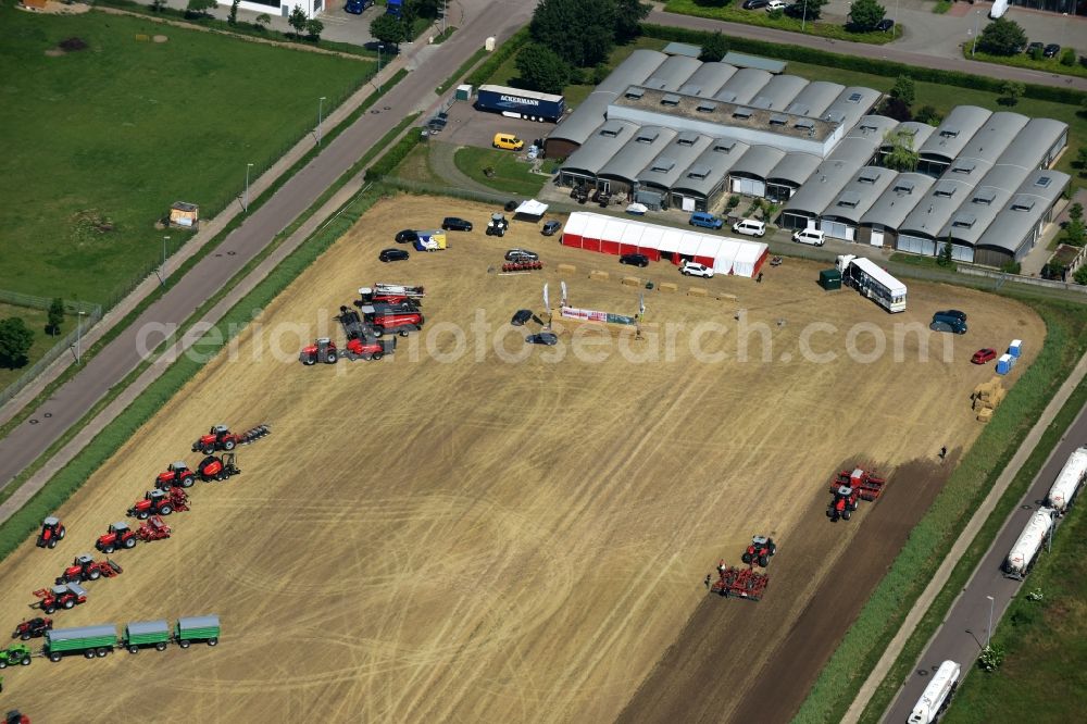 Bernburg (Saale) from the bird's eye view: Promotion and advertising event for Tractors on a field in Bernburg (Saale) in the state Saxony-Anhalt