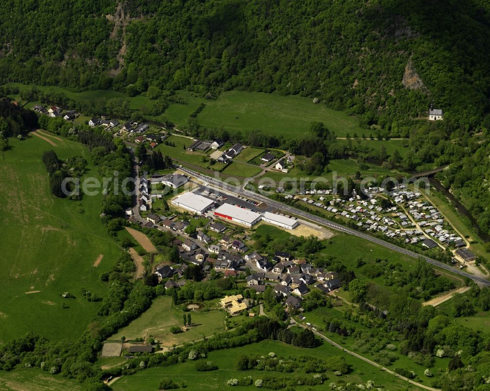 Aerial photograph Ahrbrück - View of the village Puetzfeld in Ahrbrueck in Rheinland-Pfalz. The three buildings on the main street are part of the German retail chain Penny