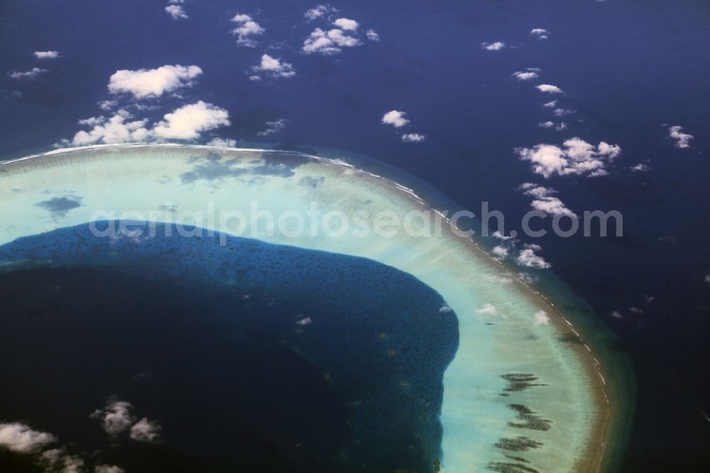 Aerial image Dharanboodhoo - Cumulus clouds overcast Coastal Indian Ocean - island in Dhahran Boodhoo in Central Province, Maldives