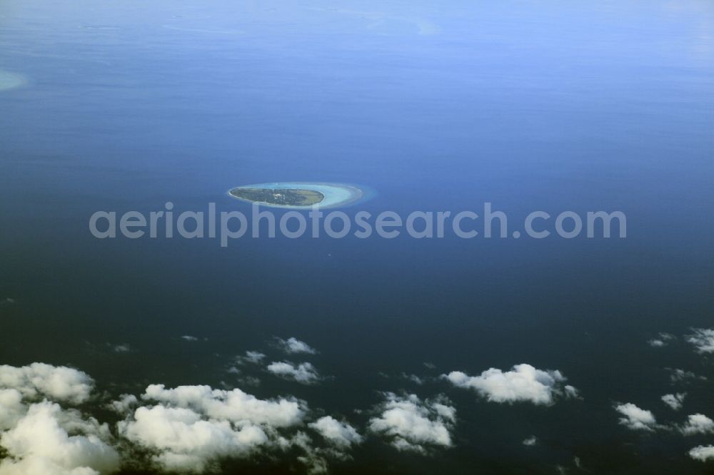 Aerial photograph Dharanboodhoo - Cumulus clouds overcast Coastal Indian Ocean - island in Dhahran Boodhoo in Central Province, Maldives