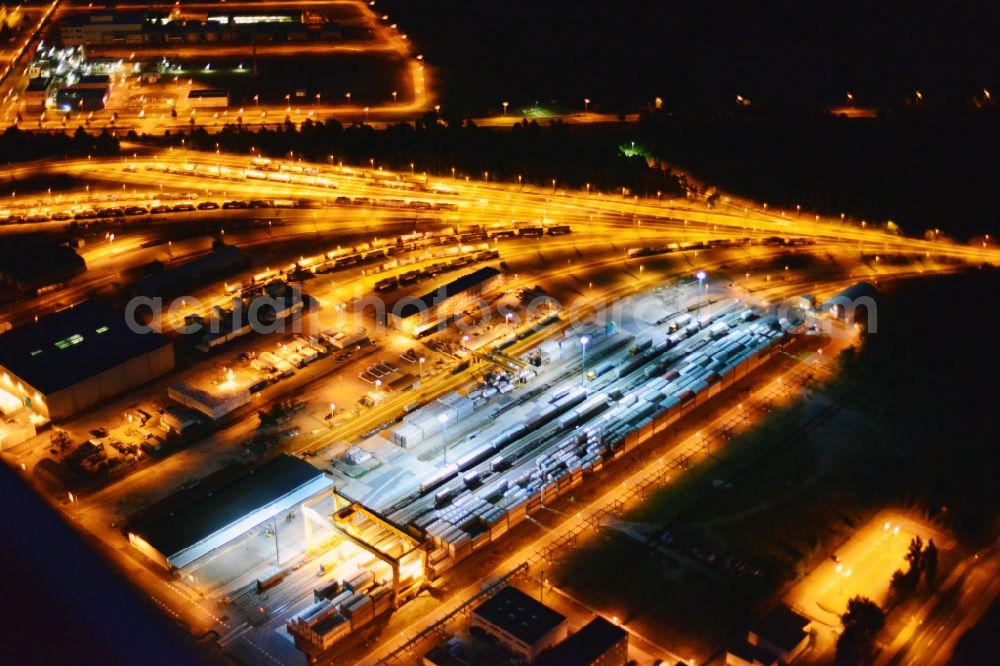 Schwarzheide from above - Night view Refinery equipment and management systems on the factory premises of the chemical manufacturers BASF Schwarzheide GmbH in Schwarzheide in the state Brandenburg