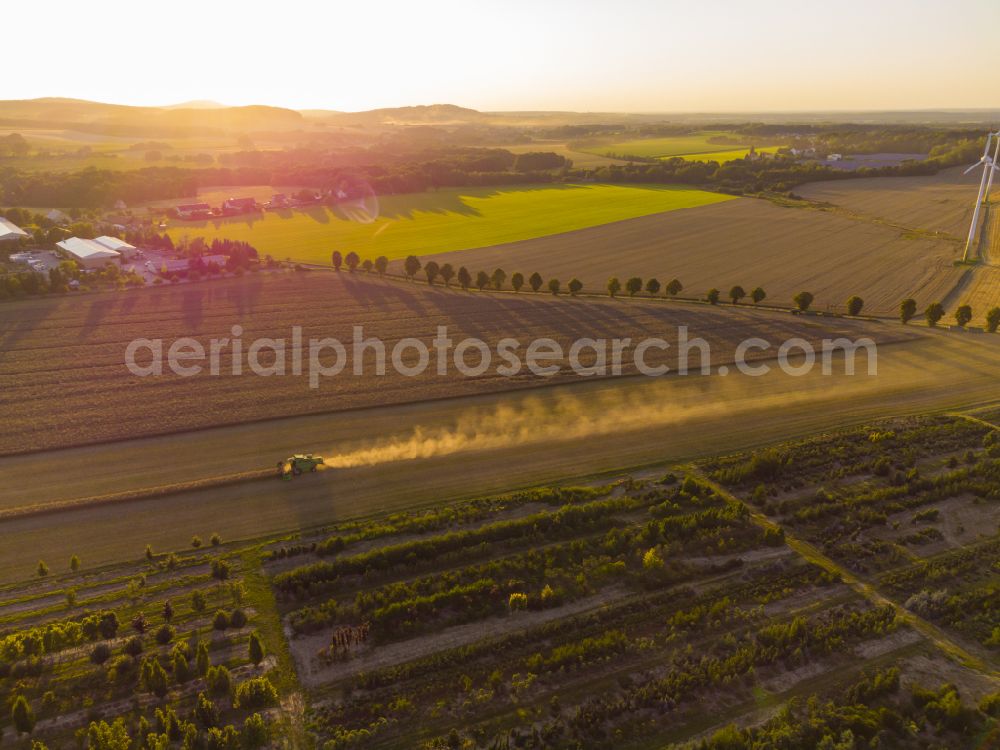 Aerial image Elstra - Rapeseed harvest with a Deutz -FAHR 5690 HTS combine harvester in Elstra in the state of Saxony, Germany