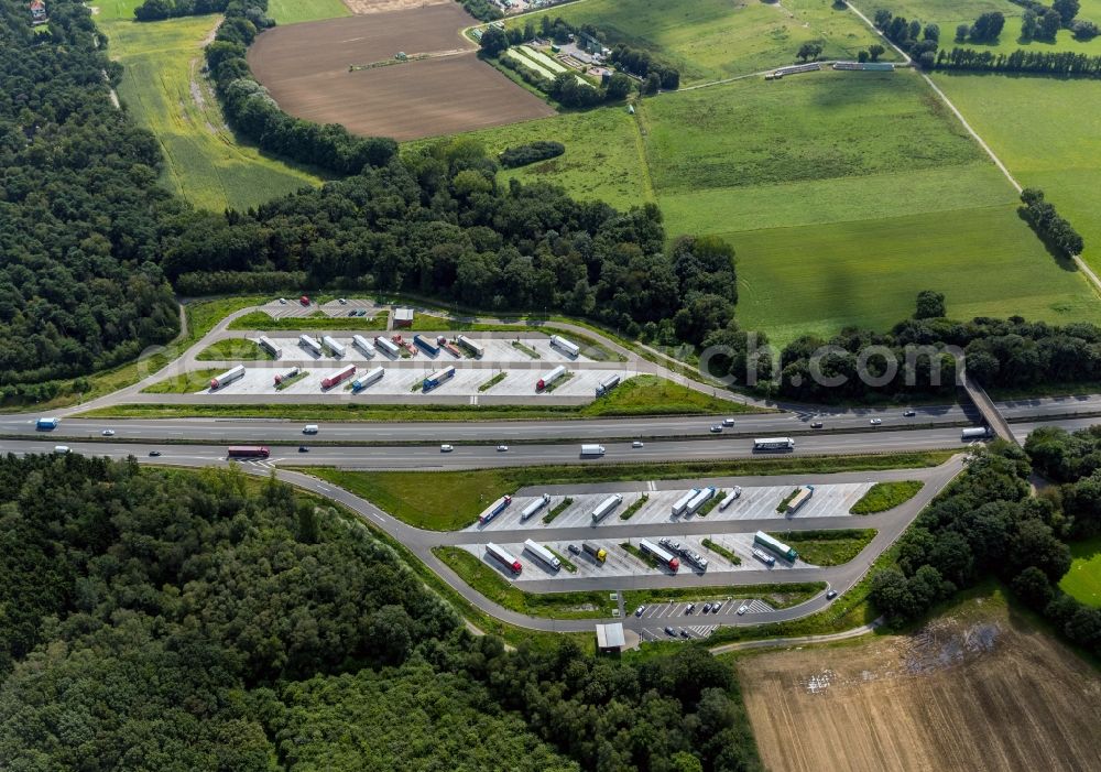 Rheurdt from above - Car parks on a motorway services in Rheurdt in the state North Rhine-Westphalia. Several trucks are visible on the parking area