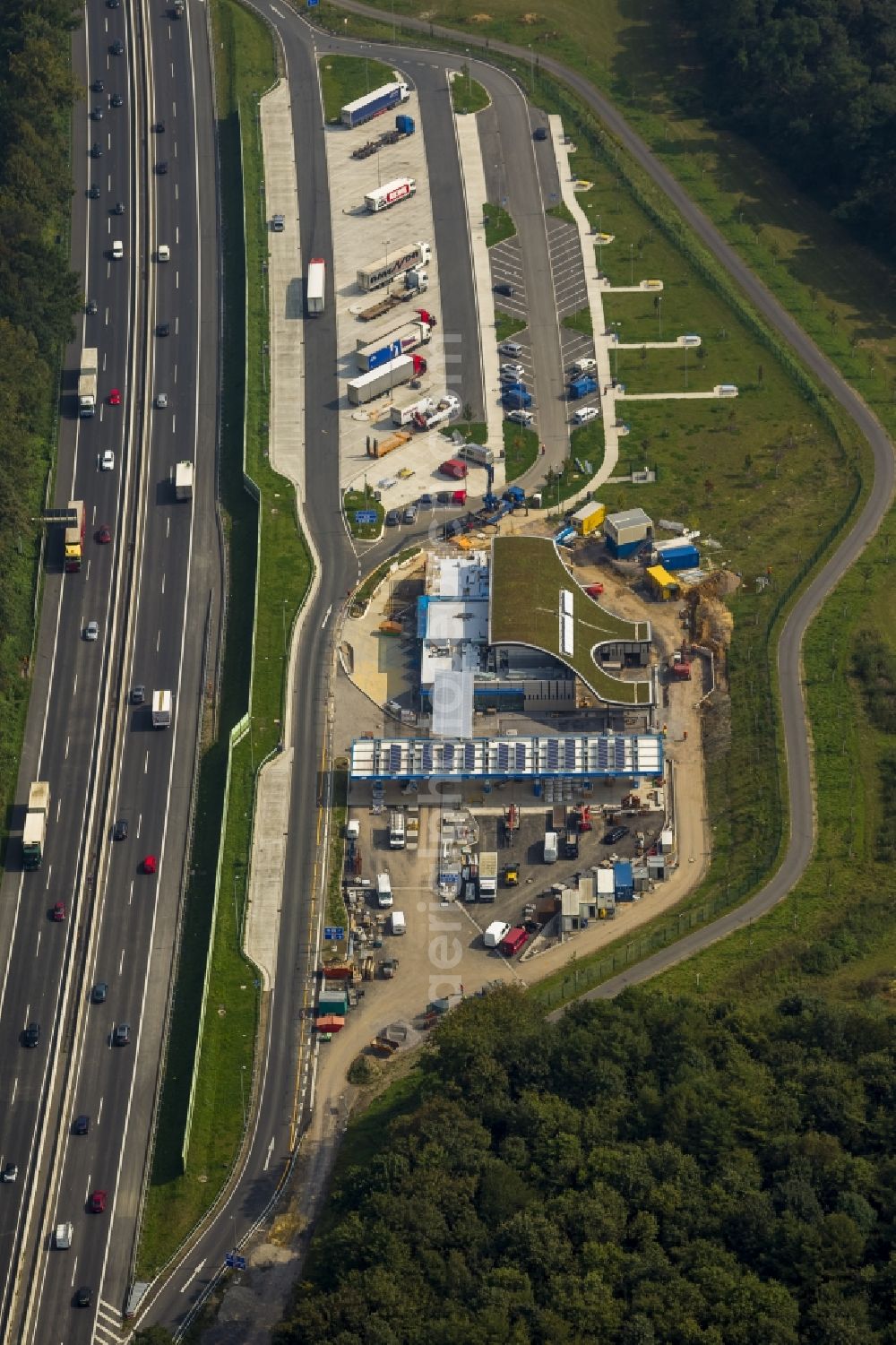 Dortmund from above - Building lot of a motorway services on the motorway A40 (Autobahn A40) in Dortmund in the state North Rhine-Westphalia. The parking area for trucks is already completed. The motorway is a part of the so-called Ruhrschnellweg