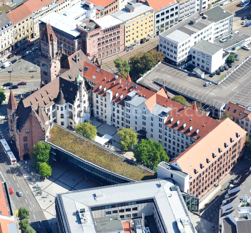 Aerial image Saarbrücken - Areal des Saarbrückener Rathaus St. Johann im Saarland. Das Gebäude im neugotischen Stil wurde 1897 nach Entwürfen des Architekten Georg J. von Hauberrisser errichtet. Die Frontseite ist original erhalten und der 54 Meter hohe Turm geschmückt mit Sandsteinfiguren, die die alten Handwerksstände darstellen. Area of Saarbrücken town hall St. Johann in Saarland. The neo-Gothic building was constructed in 1897 after drafts of architect Georg J. von Hauberrisser. The front is in good preservation and 54 metres high tower is decorated with sandstone figures showing old handicraft scenes.