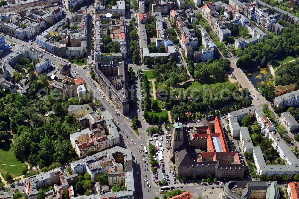 Berlin from above - The Rathaus Schoeneberg is at the Martin-Luther-Strassße in the district of Schoeneberg in Berlin. In the time of the division of the city in this building was the seat of the Governing Mayor of Berlin. Here prominent guests of the city were received regularly. The Schoeneberg Town Hall was built 100 years ago, according to the designs of architect Peter Jurgensen and Juergen Bachmann. Located next to the Town Hall is the Rudolph Wilde Park with the duck pond. Under the Carl Zuckmayer Bridge underground station Rathaus Schoeneberg is hidden