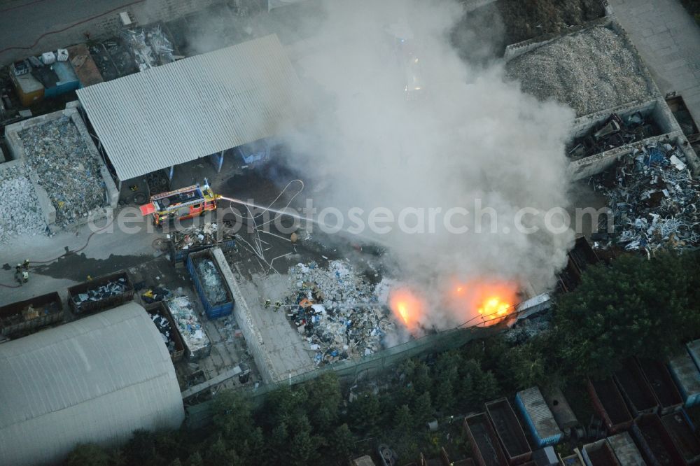 Storkow (Mark) from above - Smoke and flames during the fire fighting to fire beim Entsorgungsfachbetrieb Kiesewetter GmbH in Storkow (Mark) in the state Brandenburg