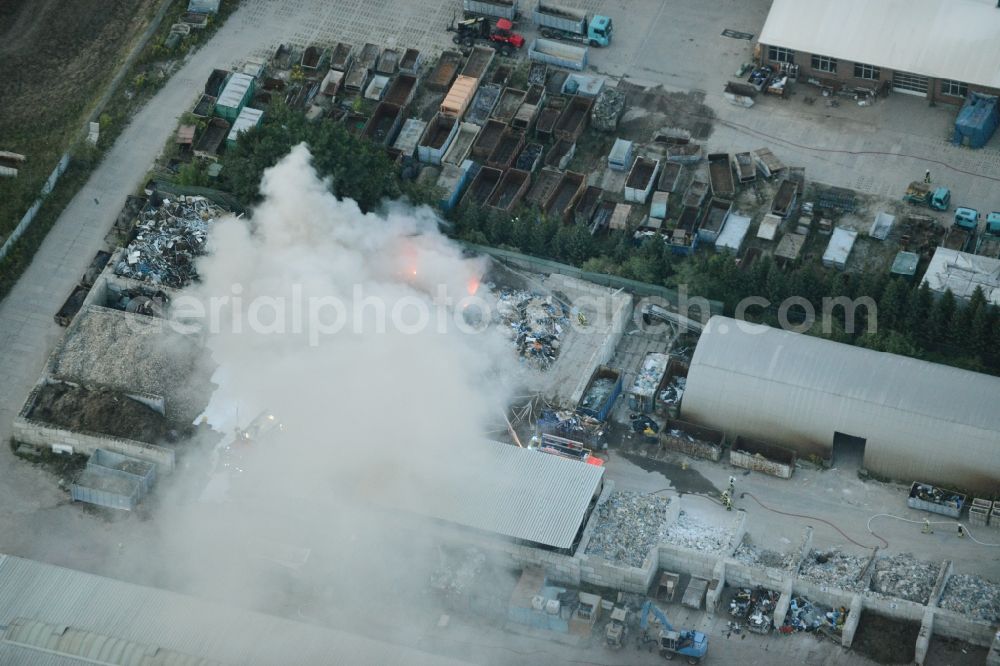 Storkow (Mark) from above - Smoke and flames during the fire fighting to fire beim Entsorgungsfachbetrieb Kiesewetter GmbH in Storkow (Mark) in the state Brandenburg