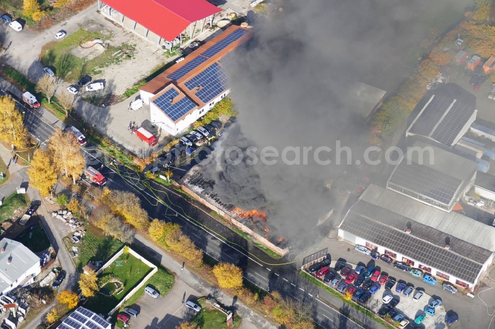 Reinhardshagen from above - Smoke and flames during the fire fighting to fire einer Lagerhalle in Reinhardshagen - Vaake in the state Hesse, Germany