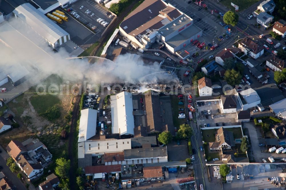 Aerial image Speyer - Smoke and flames during the fire fighting to fire of a storage all for antiqities in the Werkstrasse in Speyer in the state Rhineland-Palatinate, Germany