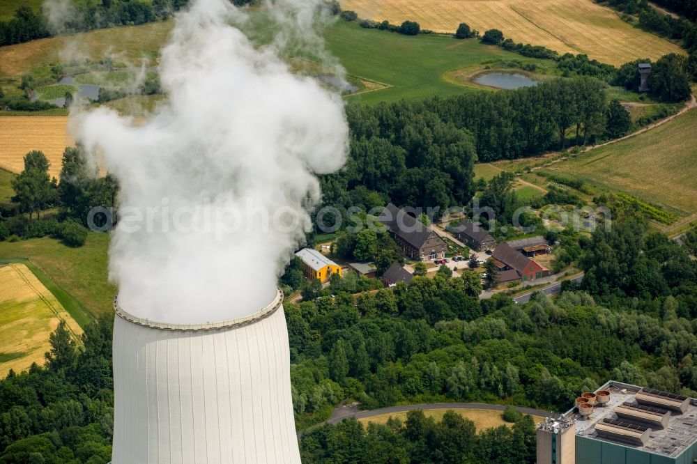 Aerial image Bergkamen - Smoke and cooling tower of the power station of Bergkamen in the state North Rhine-Westphalia. The stone-coal power station is a joint site of STEAG and RWE Power. The Biological Station of Bergkamen-Heil is located in the background