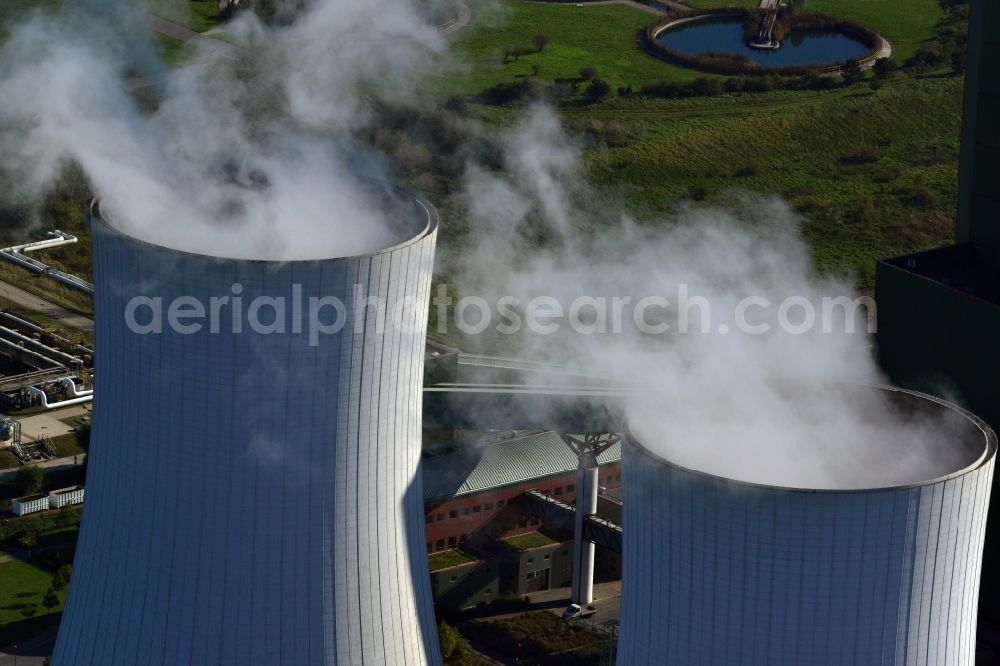 Aerial photograph Schkopau - View of power plant smokestacks in the mirror image of Rattmansdorfer pond in Schkopau in the state of Saxony-Anhalt. The two chimneys are part of the lignite-fired power plant of E.ON AG