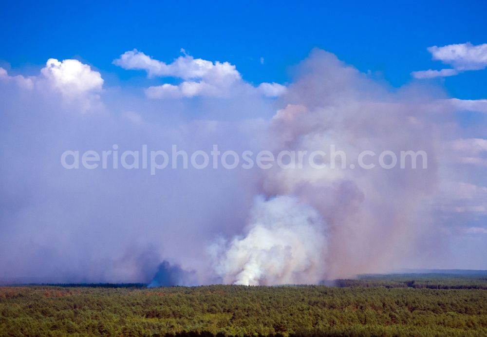 Aerial image Lübtheen - Smoke clouds by the Great Fire - destroyed forest fire tree population in a wooded area - forest terrain in the district Broemsenberg in Luebtheen in the state Mecklenburg - Western Pomerania, Germany