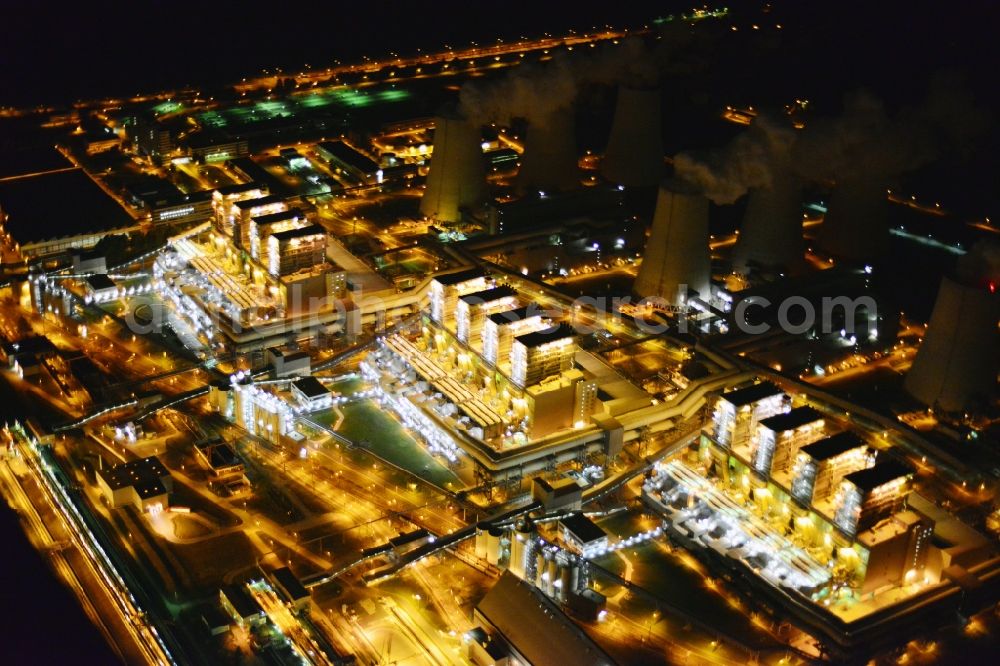 Jänschwalde from the bird's eye view: Night shot of Wads of smoke of the chimneys of the power plant Jaenschwalde in the state Brandenburg