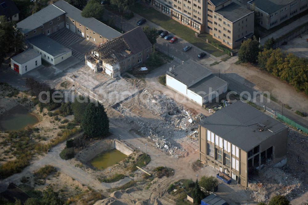 Aerial photograph Berlin - Blick auf die Abrissfläche / den Rückbau vom Haus 9 und Haus 15 (Kesselhaus) auf dem Gelände des Vivantes Klinikum Hellersdorf. Hier sollen Parkflächen entstehen. Kontakt Ver- und Entsorgungskonzept: Genius Ingenieurbüro GmbH, Treskowallee 30, 10318 Berlin, Tel. +49(0)30 818584-0, Fax +49(0)30 818584-99, email: krebs@ibgenius.de