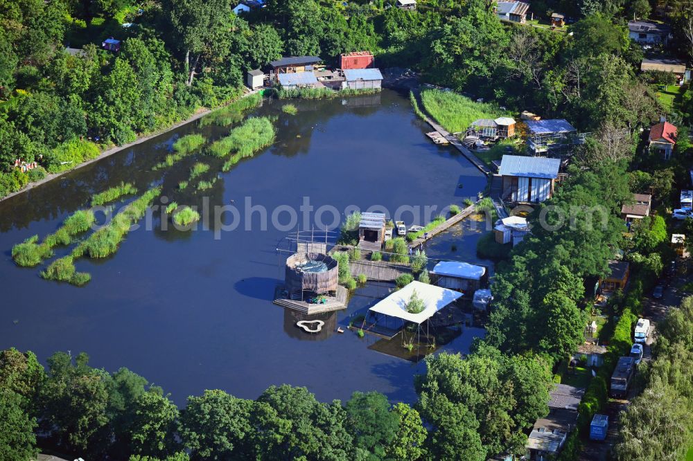 Berlin from the bird's eye view: Rainwater collection basin as a retention basin and water reservoir at Lilienthalstrasse - Columbiadamm in the Tempelhof district of Berlin, Germany