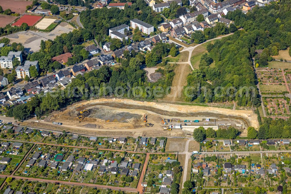 Aerial photograph Essen - Construction site for the new construction of the retention basin and water storage at the Pausmuehlenbach next to the allotment garden settlement of the allotment garden association Weidkamp in the district Gerschede in Essen at Ruhrgebiet in the state North Rhine-Westphalia, Germany