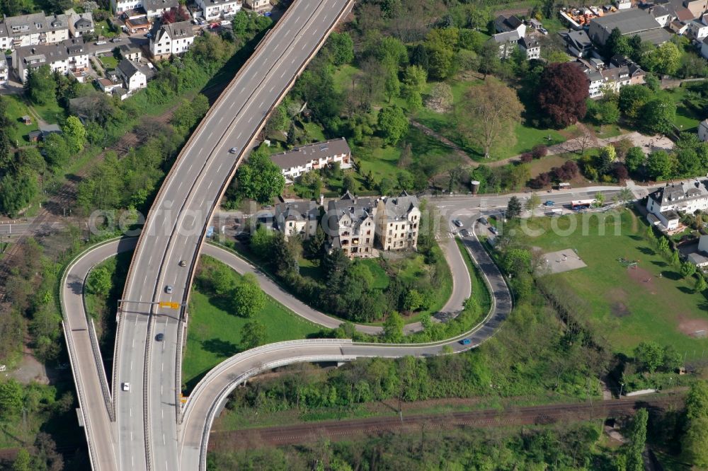 Koblenz from above - Parts of Koblenz located on the right Rhine side and the federal road 327 in Koblenz in the state of Rhineland-Palatinate. The city parts - like Horchheim - are located on the right riverbank and partly wooded or surrounded by forest, hills and nature. The road 327 in the foreground starts with crossing the river Rhine in Koblenz