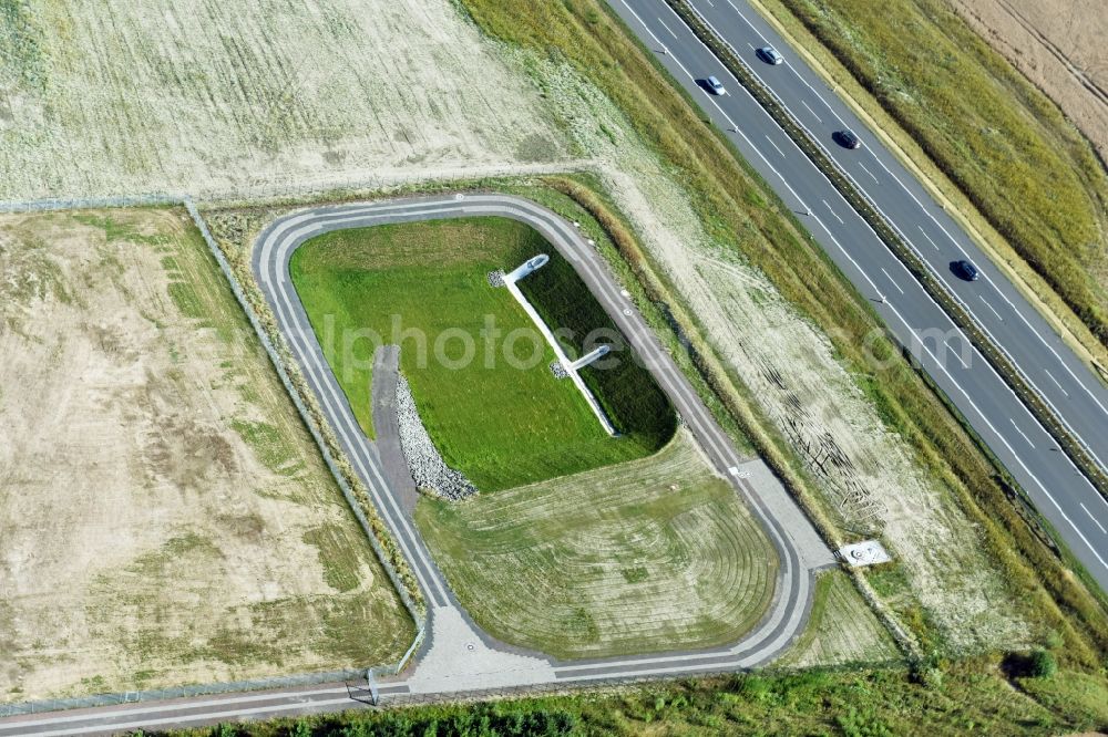 Borna from the bird's eye view: Rainwater retention basins and fire water pond aloung the Highway- Construction site with earthworks along the route and of the route of the highway route B95 to A72 motorway in Borna in the state Saxony