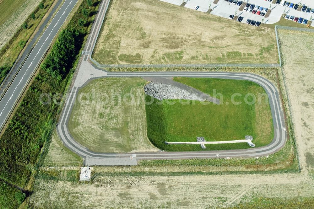 Borna from the bird's eye view: Rainwater retention basins and fire water pond aloung the Highway- Construction site with earthworks along the route and of the route of the highway route B95 to A72 motorway in Borna in the state Saxony